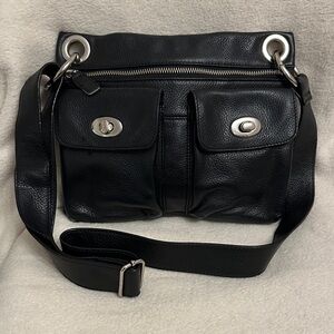 Danier genuine leather crossbody bag featuring silver-toned hardware.